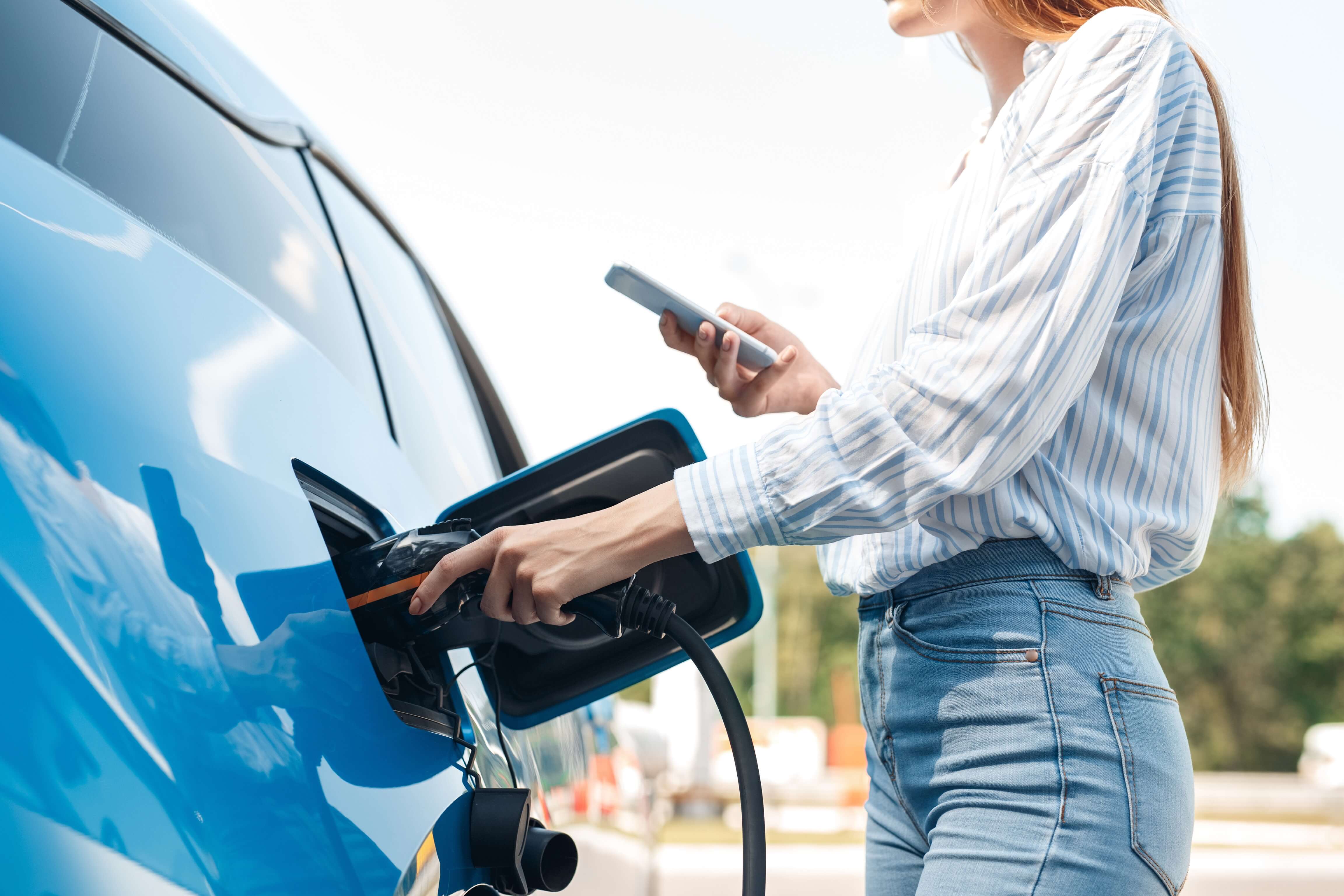 woman charging an ev